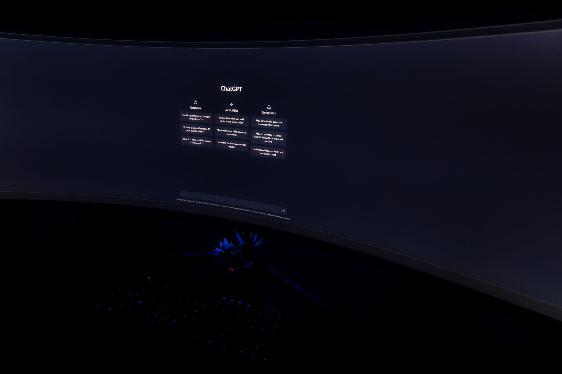 Over-the-shoulder shot of a 27-inch display showing an AI ad management interface optimizing campaign bids. Warm desk lamp light. Screen is the sole subject, no human in frame.