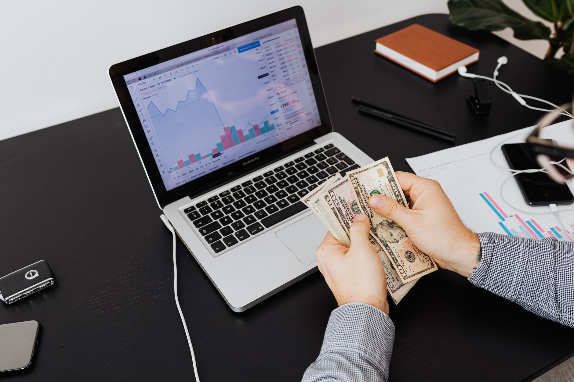A slightly-rotated polaroid screenshot of a Stripe dashboard or ad account showing a row of $2k+ daily payouts. Screen is the sole subject, no human in frame. Real URLs and timestamps visible. Looks like a real screenshot, not a polished stock photo.