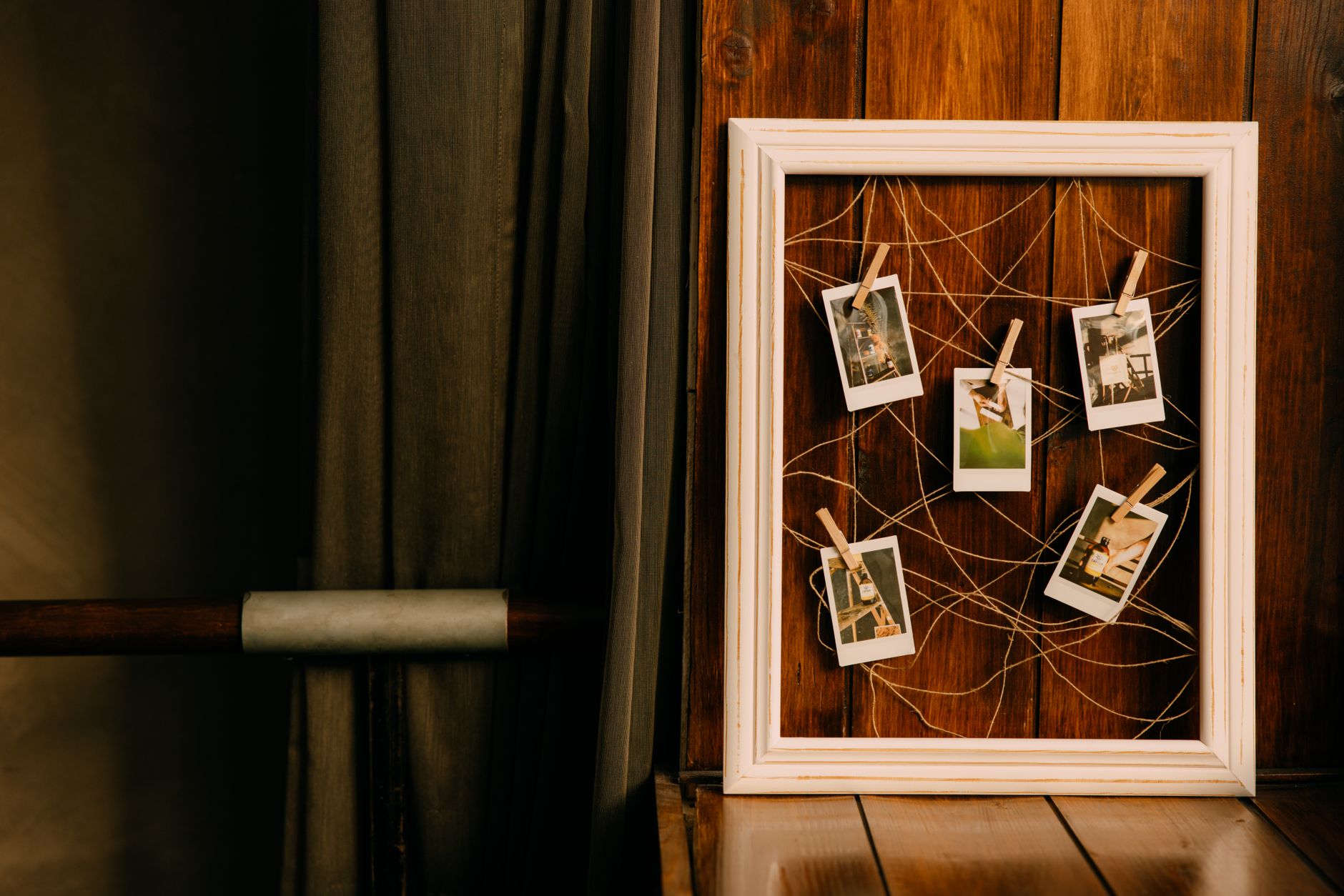 A slightly-rotated polaroid screenshot of a real Stripe dashboard showing a row of $5,000+ weekly payouts, timestamp visible. Framed cleanly against an anchor-tone band. Looks like the user snapped it themselves on a phone—imperfect angle, real environment, not a polished stock photo. Screen is the sole subject, no human in frame.