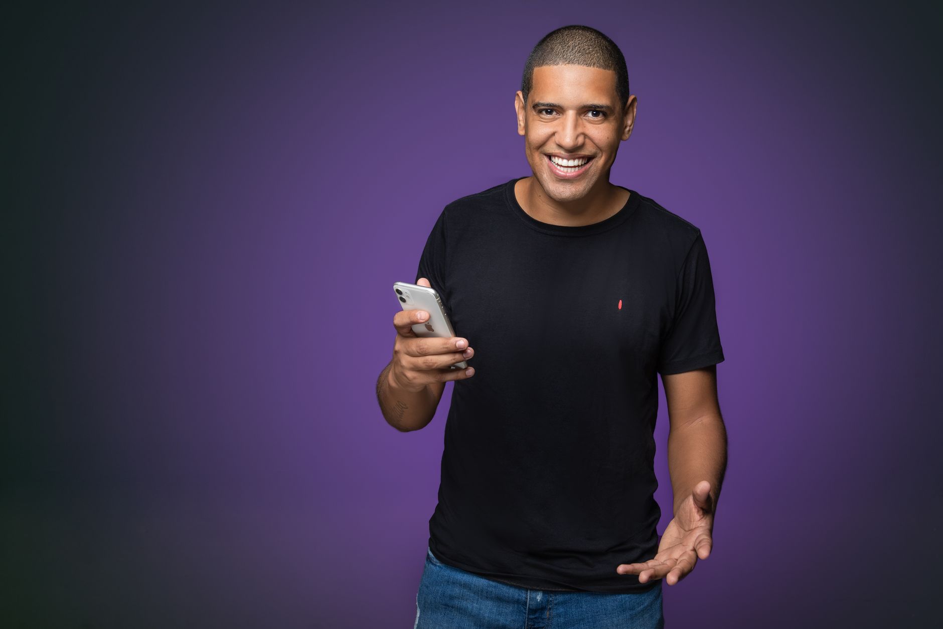Headshot of a real digital entrepreneur in their actual working environment, not a polished studio portrait. Looks like the user snapped it themselves on a phone.